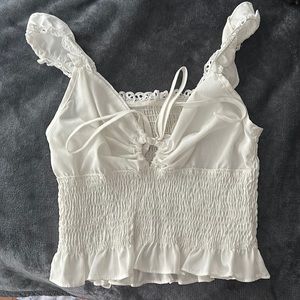 Cute ruffled tank top with a tie